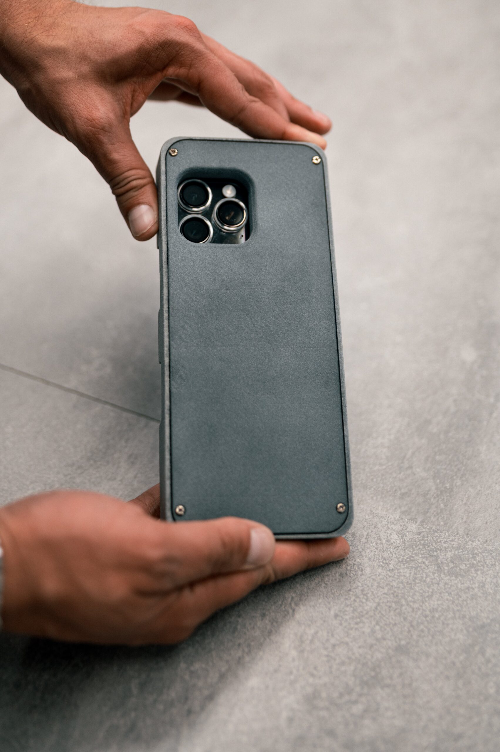 Ultra Guard Case shown with compatible iPhone and Android smartphones for secure communication